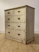 A Circa 1900 painted pine chest, fitted with two short and three long graduated drawers, on a