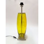 A lemon coloured glass ovoid table lamp with chrome mounted top and stepped square base, (