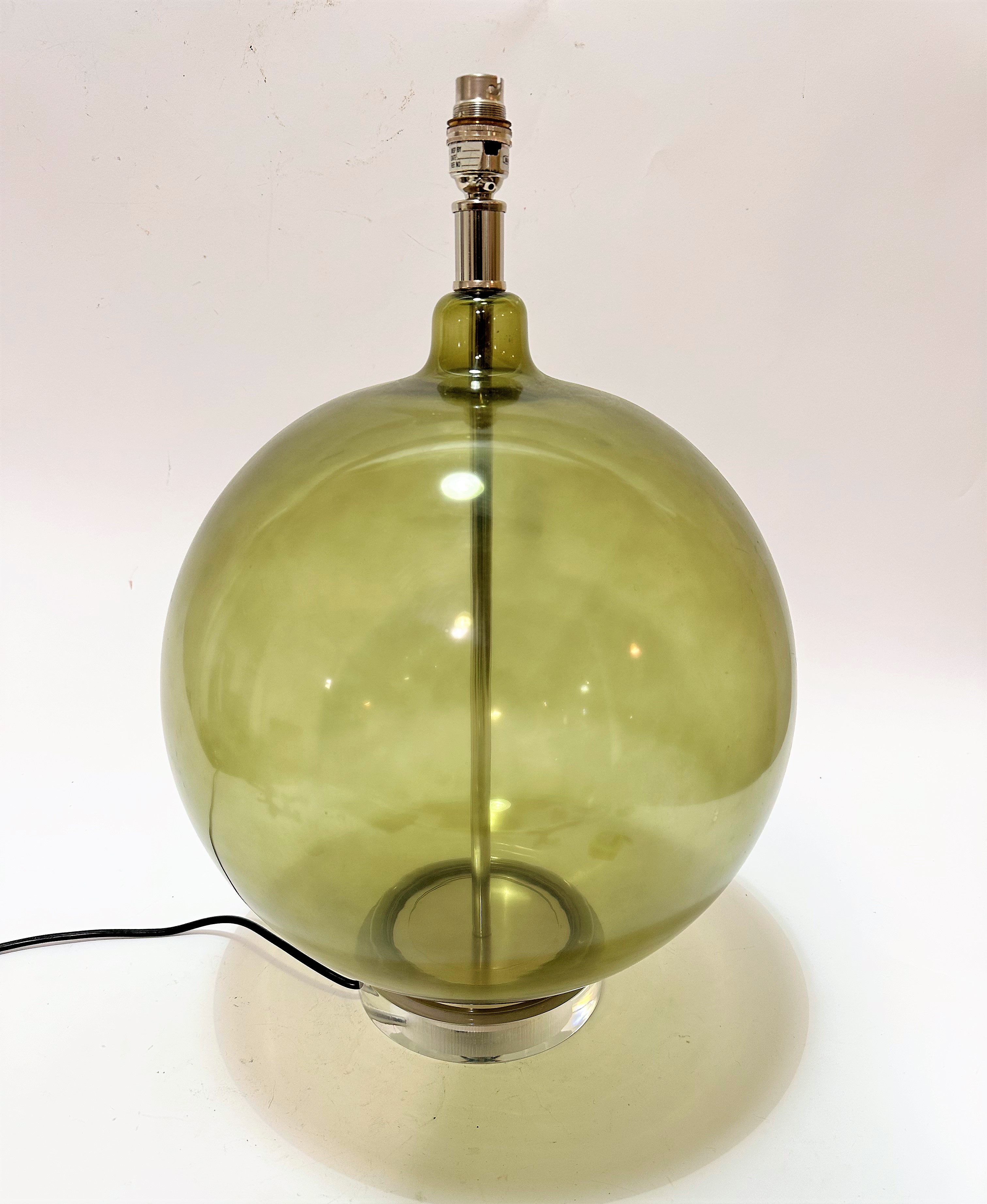 A green bulbous glass table lamp with chrome mounted circular base and fitting (including light 54cm