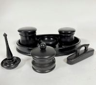 An Edwardian ebony seven piece dressing table set including two circular dishes with domed