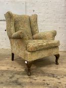 A Queen Anne style upholstered wingback chair, early 20th century, H94cm, W80cm, D80cm