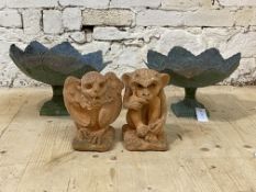 A pair of reconstituted stone gargoyles (H20cm) together with a pair of cast and hammered bird baths
