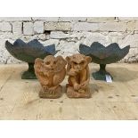A pair of reconstituted stone gargoyles (H20cm) together with a pair of cast and hammered bird baths