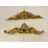 A matched pair of Rococo style gilt composition wall apliques, each moulded in the form of scrolling