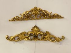 A matched pair of Rococo style gilt composition wall apliques, each moulded in the form of scrolling