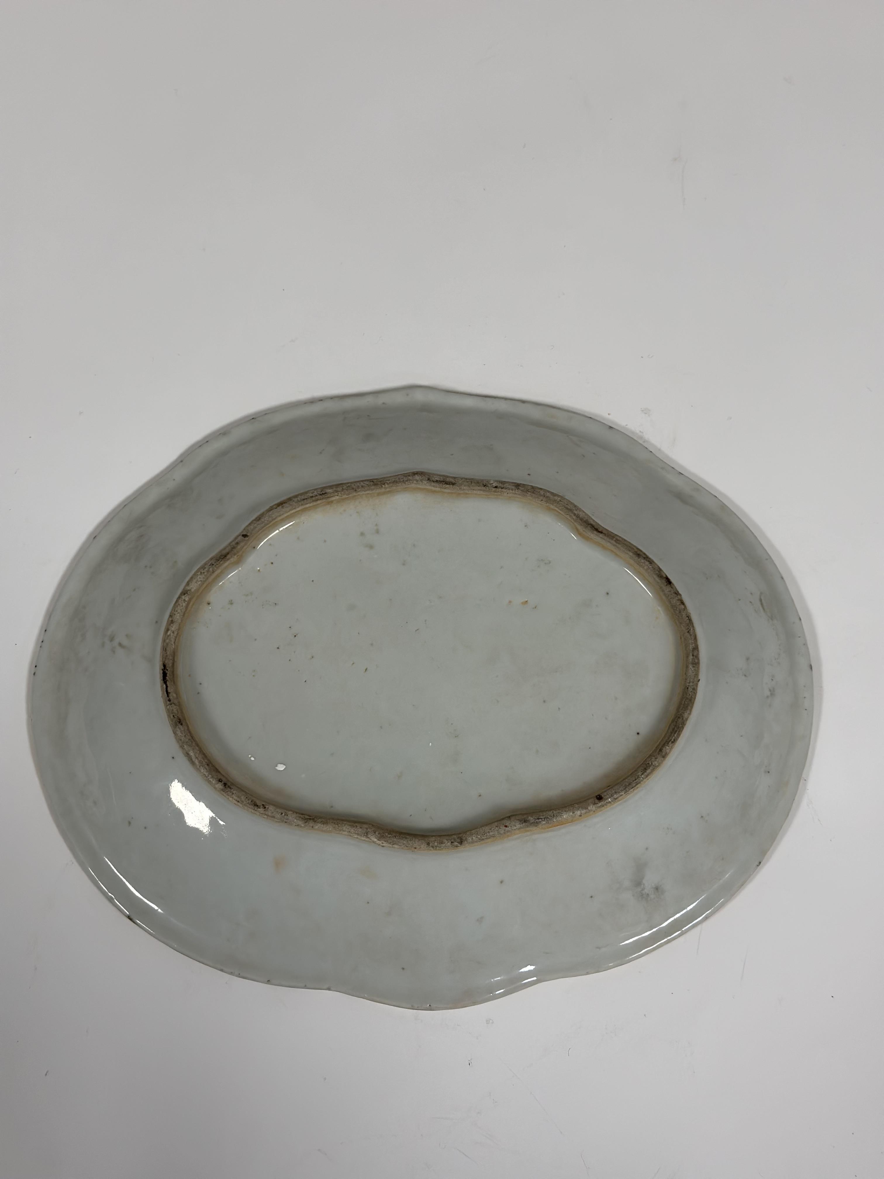 A 19th century Chinese Canton famille rose dish, of shaped oval form, painted with alternating - Image 2 of 3