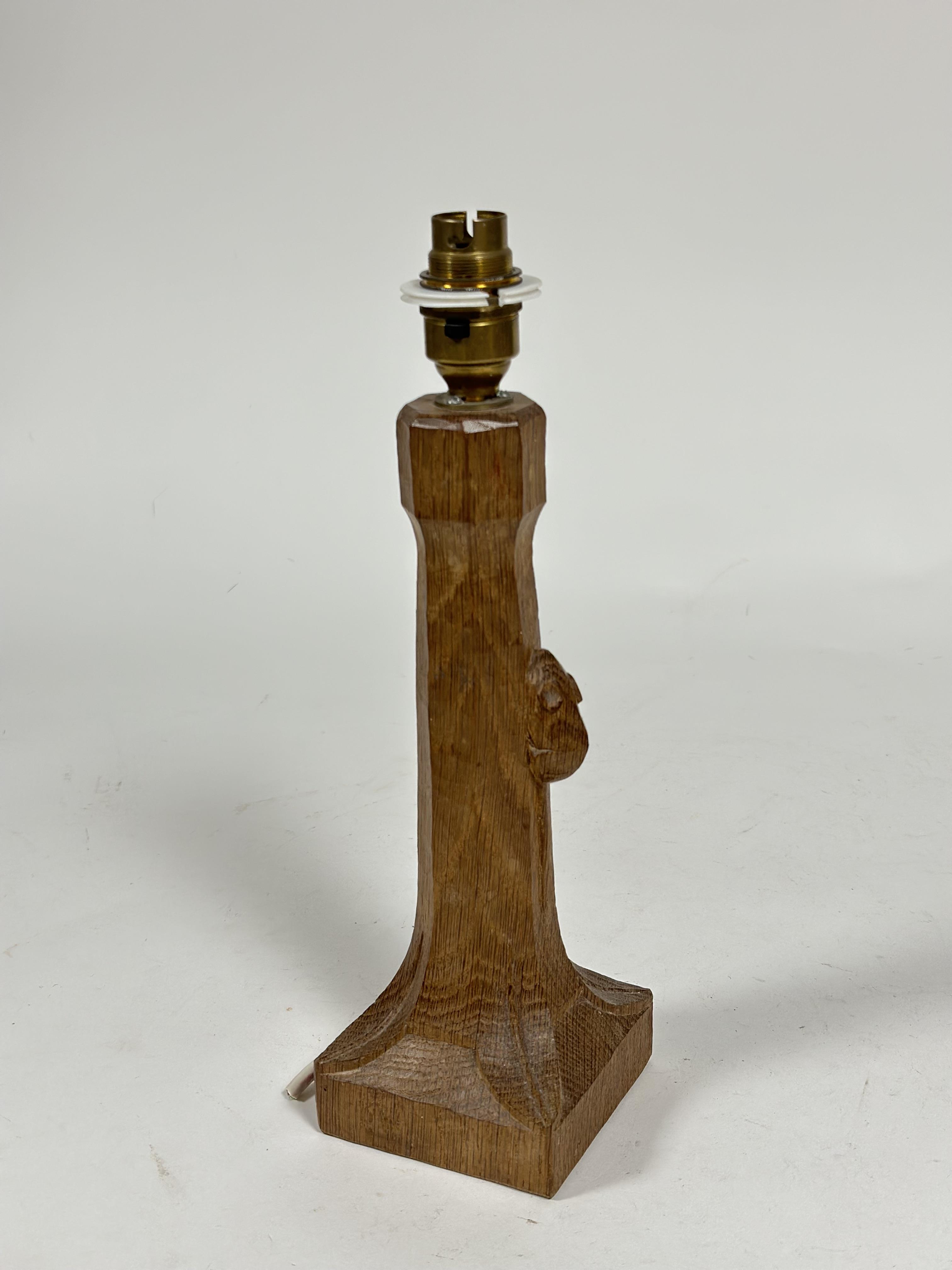 Workshop of Robert Mouseman Thompson, an oak table lamp, on a square base, with carved mouse