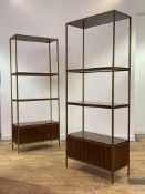 A pair of teak and gilt metal etageres in the Mid Century style, each with three open shelves