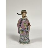 A Chinese famille rose porcelain figure of an Immortal, probably late 19th century, modelled