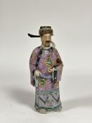 A Chinese famille rose porcelain figure of an Immortal, probably late 19th century, modelled