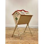 An early 20th century Scandinavian cream and floral painted music Canterbury, with pierced carry