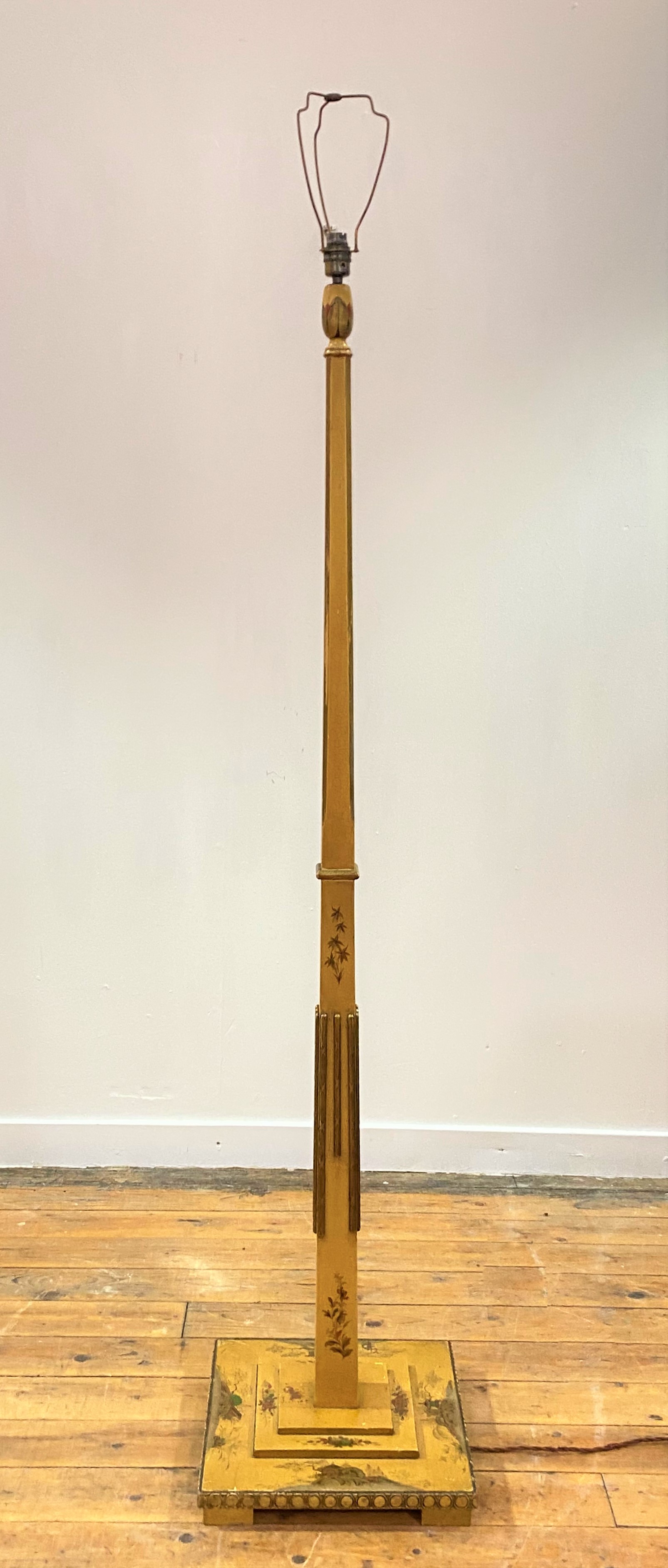 A parcel gilt and lacquered chinoiserie floor lamp, circa 1920, the square tapered and chamfered