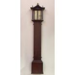 A Regency rosewood cased stick barometer, the moulded arched top with three brass urn finals over