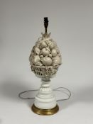 A large Casa Pupo white-glazed table lamp, c. 1970, modelled as a tall basket of fruit, on a