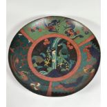 A large cloisonne charger, 19th century, the central roundel depicting a pair of birds, within three