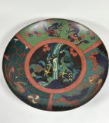 A large cloisonne charger, 19th century, the central roundel depicting a pair of birds, within three