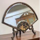 A black Japanned Chinoiserie easel mirror of fan form, the frame gilt-decorated, with bevelled