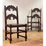 A set of six (4+2) oak Derbyshire chairs of 17th century design, each with shaped, scrolled and