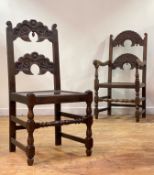 A set of six (4+2) oak Derbyshire chairs of 17th century design, each with shaped, scrolled and