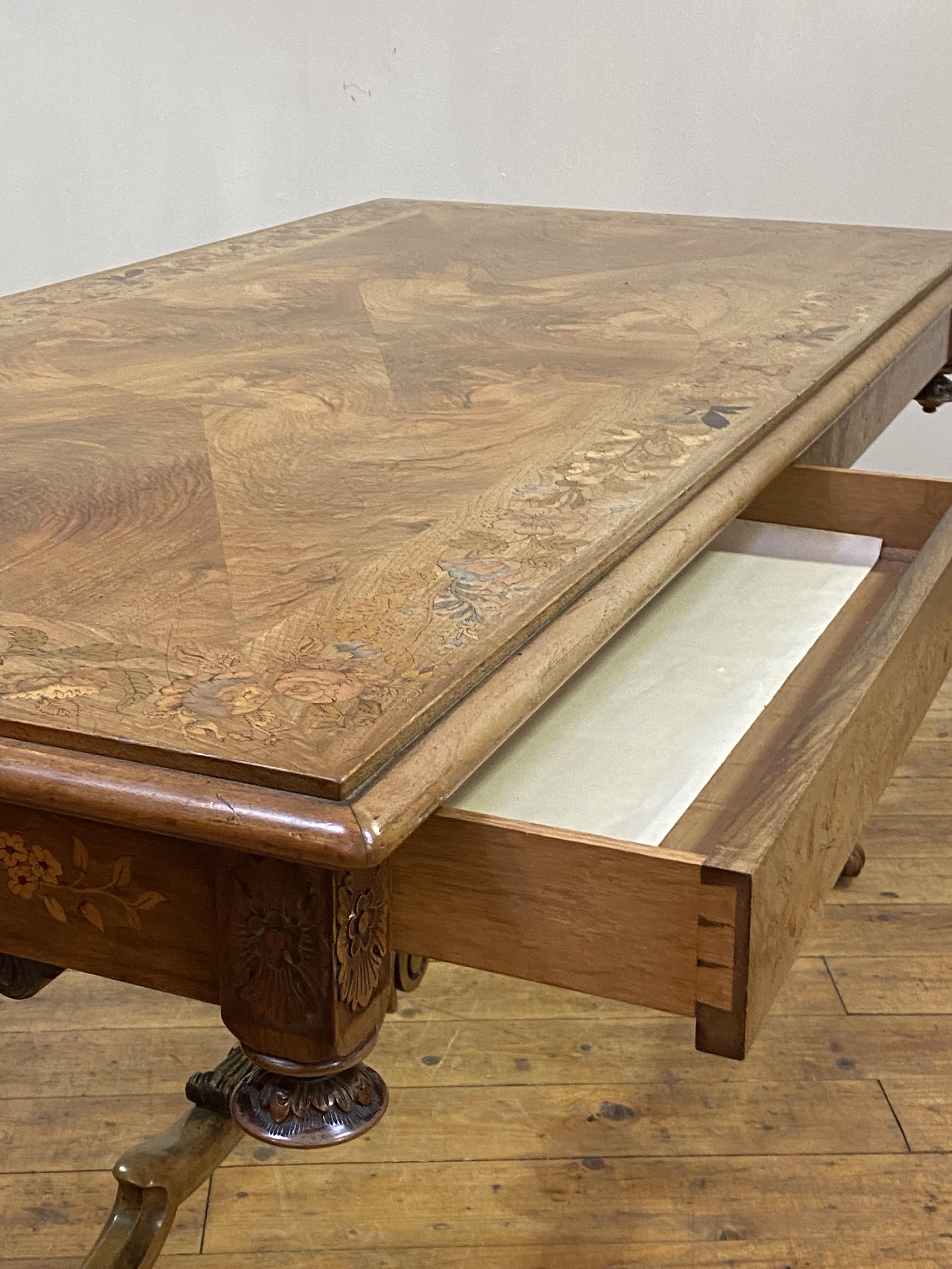 A fine Dutch walnut library table, 19th century, the cross banded top with radial circular and - Image 3 of 5