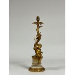 A Rococo Revival gilt-metal and alabaster table lamp, modelled with a putto holding a trident and