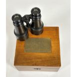 A pair of 19th century French binoculars, in a mahogany case with internal label "Iseli