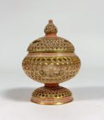 Zsolnay Pecs: a reticulated bonbonniere dish and cover, decorated in pink and gilt, on a circular