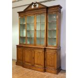 A pitch pine breakfront bookcase in the Georgian taste, second half of the 20th century, the