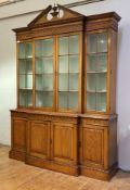 A pitch pine breakfront bookcase in the Georgian taste, second half of the 20th century, the