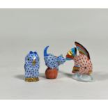 A group of three small Herend models: an angel fish in the red fishnet pattern; a kitten on a ball