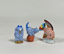 A group of three small Herend models: an angel fish in the red fishnet pattern; a kitten on a ball