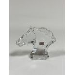 Baccarat: a glass model of a horse's head, with etched marks, paper labels and in original