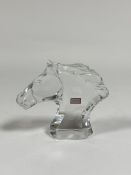 Baccarat: a glass model of a horse's head, with etched marks, paper labels and in original