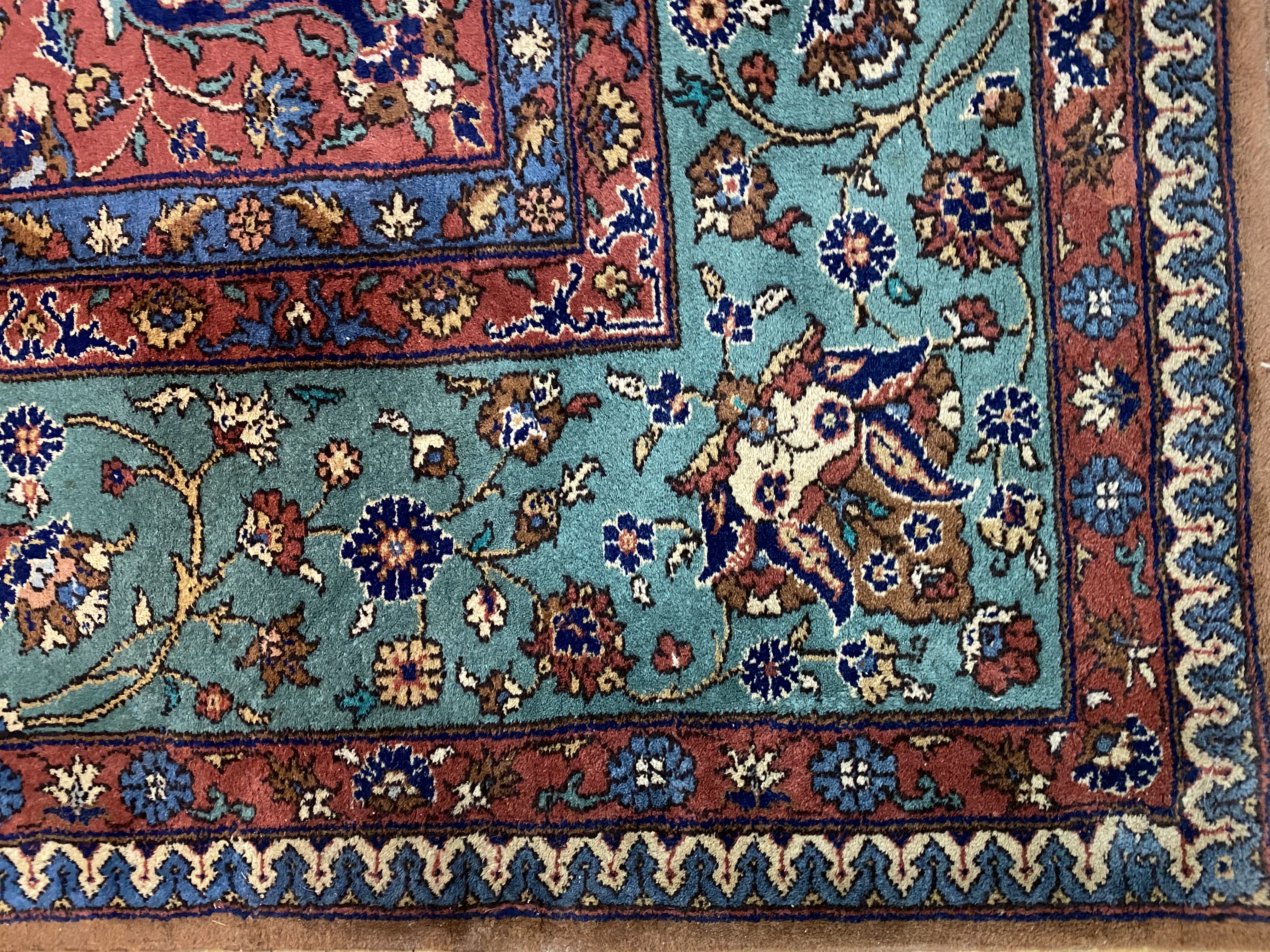A large North West Persian carpet, hand knotted, the field of blues, browns and reds with - Image 2 of 3