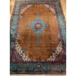 A large North West Persian carpet, hand knotted, the field of blues, browns and reds with