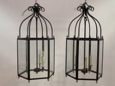Lonsdale and Dutch, a pair of Regency Crown design cast iron hall lanterns of hexagonal outline,