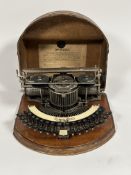 A Hammond No. 2 curved keyboard type-shuttle typewriter, c. 1890-1900, with celluloid label and in