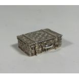 A silver pill box, modelled as a picnic basket, Hamilton & Inches, Edinburgh, 2010. 15mm by 40mm