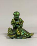Zsolnay Pecs: a group of a Girl and a Goose, in an eosin green/gold glaze, printed mark. Height 19.