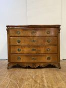 A Continental walnut commode of serpentine outline, 19th century, the plain top over four long