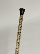 A shark vertebrae walking cane, c. 1900, with horn handle. Length 86cm