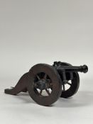 A model bronze cannon, in 17th century style, the barrel inscribed with a spurious date "Ao 1666",