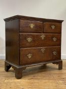 A vernacular oak chest of small proportions, late 18th century, the top with moulded edge over two