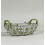 A Herend porcelain basket, oval, the latticework sides applied with foliate sprigs, the twin handles
