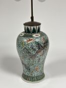 A Chinese famille verte porcelain vase of baluster form, mounted as a table lamp, decorated with