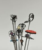 A group of thirteen silver and other hat pins, Edwardian and later including: three by Charles