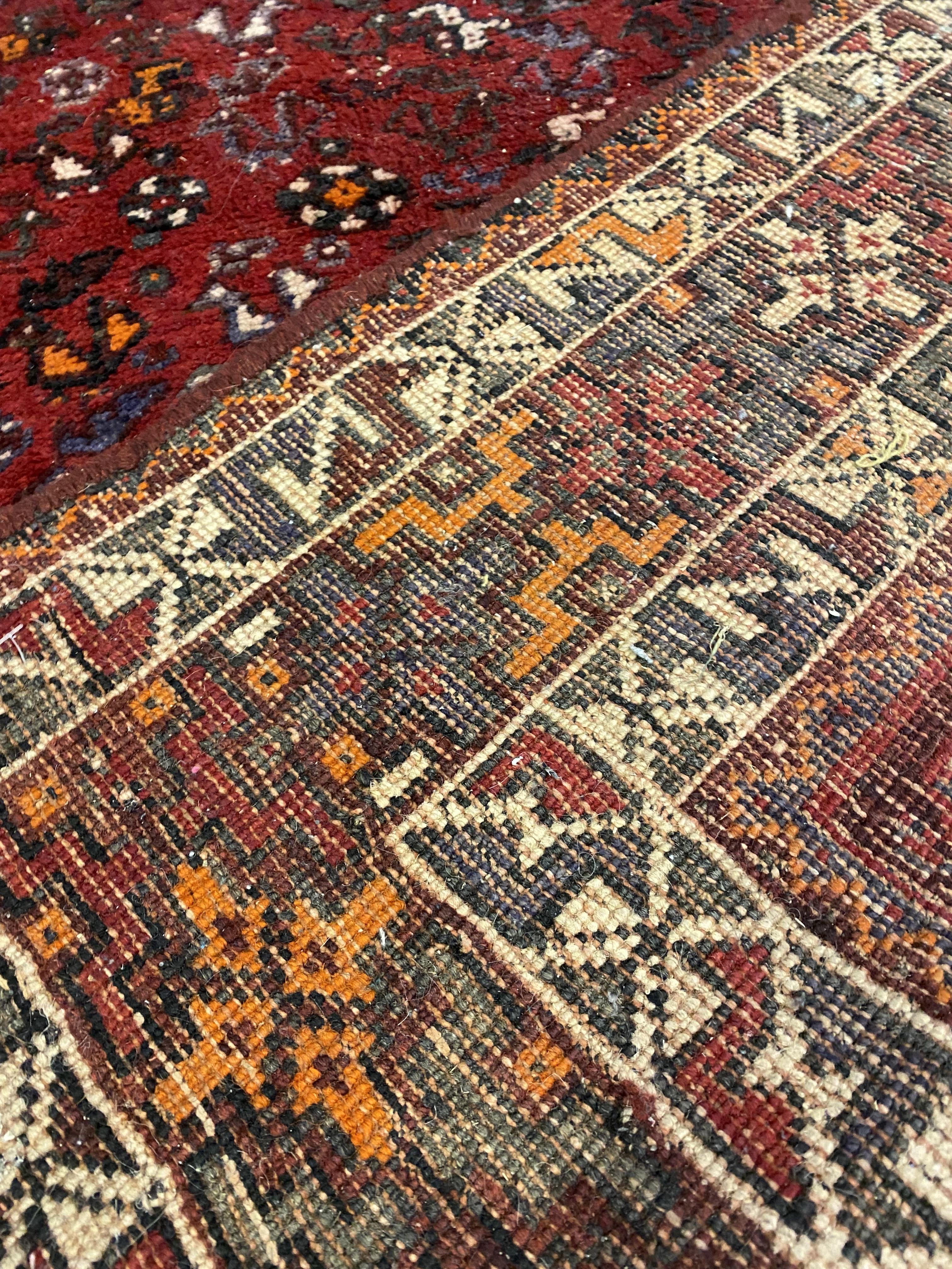 A Shiraz hand knotted carpet, the red field with pole medallion and intricately decorated with - Image 3 of 3