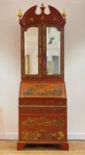 A George II style red lacquer and gilt Chinoiserie bureau bookcase, circa 1920-30, the broken arch