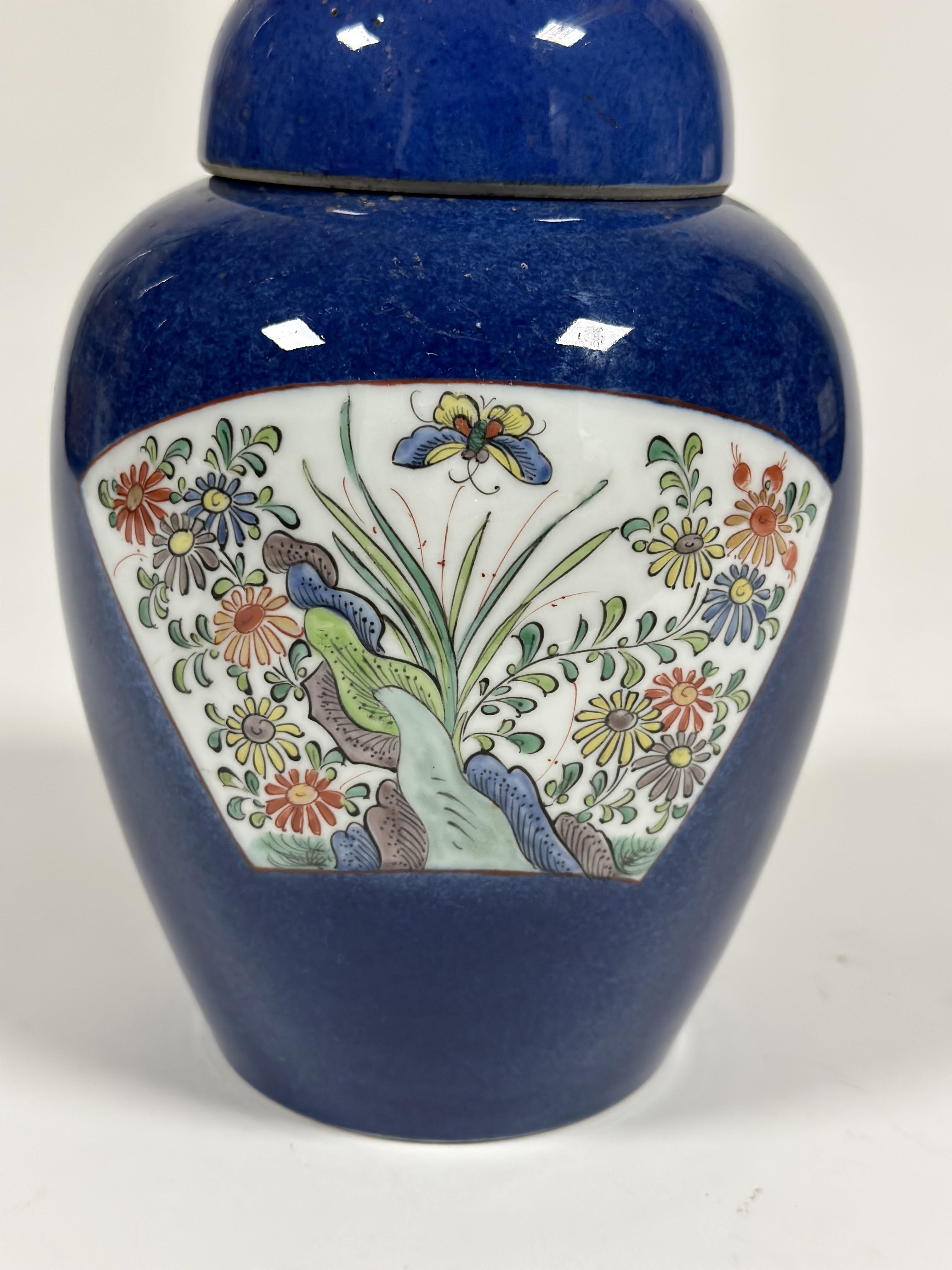 A Chinese porcelain jar and cover, painted with a pair of famille rose fan-shaped cartouches with - Image 2 of 4