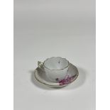 A Herend coffee cup and saucer in the puce tulip spray pattern, with ozier moulded borders,